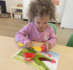 Norielle is making teeth for the crocodile.