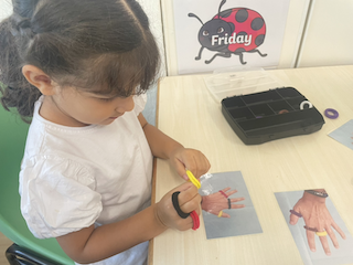 Alara is a pro at the colour band puzzle!