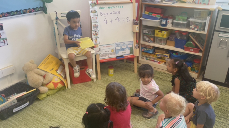 Ei shows off his clay art work to Ladybirds during show and tell!
