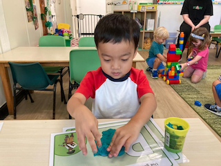 Ei using play dough to trace letters!