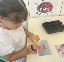 Alara is a pro at the colour band puzzle!