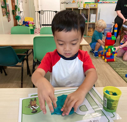 Ei using play dough to trace letters!