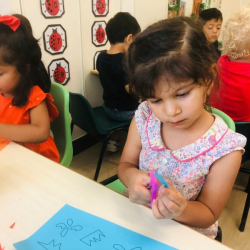 Alara focused working on her Matisse inspired artwork.