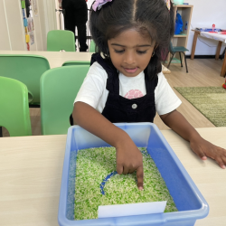 Kaavya practising letter tracing