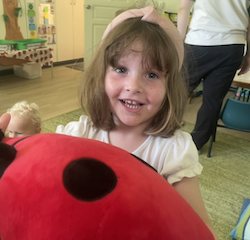Clemmie giving Mr Flappy (our ladybirds mascot) a giant hug!