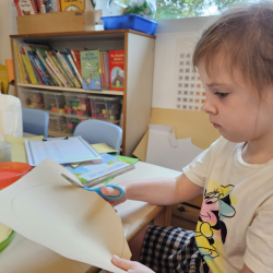 Clara being very focused in her cutting.