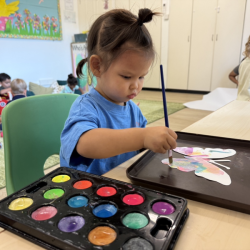 Amelia painting her butterfly!