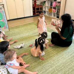 Reading a CNY book with Miss Maryanne