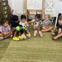 Eden pretending to be the teacher and doing circle time with her friends. 