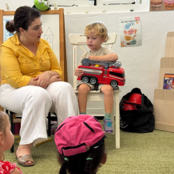 Kingston was so excited about being a fireman and sharing about his truck . 