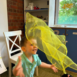 Luca is having so much fun dancing with his yellow scarf!