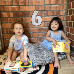 Reading in the cosy corner with Rosie and Celene.