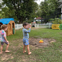 Water sprinklers and muddy puddles! What fun!