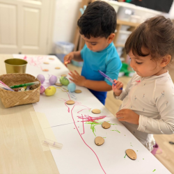 Kavi and Sara decorating ornaments with dry erase markers!