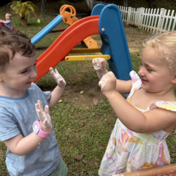 Ella and Liam comparing how white their hands are from the sensory play!
