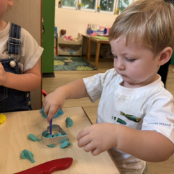 Finn enjoying playing with Playdough!