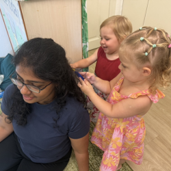 Miss Maryanne getting a hair cut by Ella and Ollie!