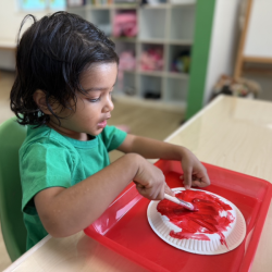 Niva Aria painting her tomato!
