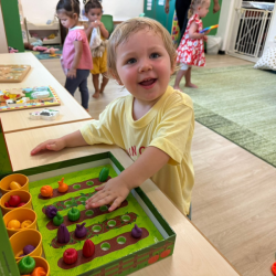 Olive is enjoying sorting the vegetables!