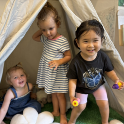 Ollie, Sienna and Ellie enjoying the tent in their new classroom during orientation!