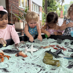 The girls enjoying the moon dough!