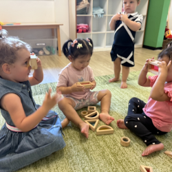 The girls looking through coloured blocks!