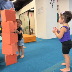 The tower of blocks are taller than Malhar!