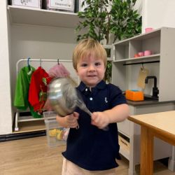 Fin making music with the pots and pans!