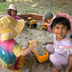 Ilyana's having a blast in the sandpit!