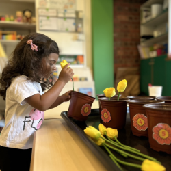 Sara's busy counting flowers!