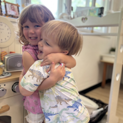 Immy and Max sharing sweet cuddles—moments we love to see!