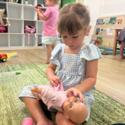 Immy dressing up her little one in style!