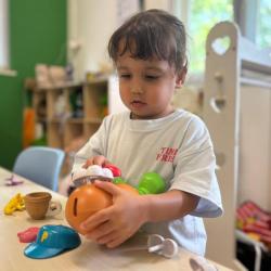 Laleh working on building a face for Mr Potato!