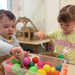 Liam and Immy scooping and transferring like pros—steady hands in action!