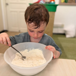 Liam on the mix — dry ingredients, meet your match!
