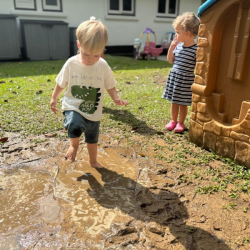 Messy? Yes! Happy? Absolutely! Max is having a muddy blast!