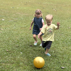 Ready, set, kick! Immy and Max in hot pursuit of the runaway ball!