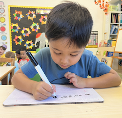 Alex doing a great job with his writing practice.