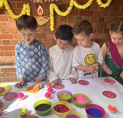 Busy bees enjoying their Rangoli time .