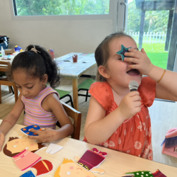 Busy bees super star, Vivi, busy singing with her mic.