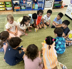 Busy bees tossing the cubes to share what they like about their friends.