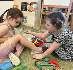 Doctor Paige checking on her patient, Vivi .