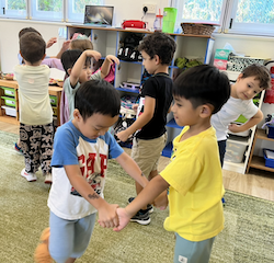 Ei and Lorenzo having a blast with music and movement.