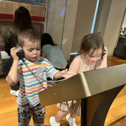 Finley and Vivi finding out information about the items in the Heritage Centre.