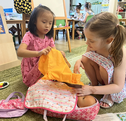 Lucy and Esme having fun with their pretend play.