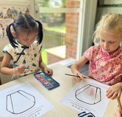 Lucy and Regan painting their “ wish lantern “ using water colour