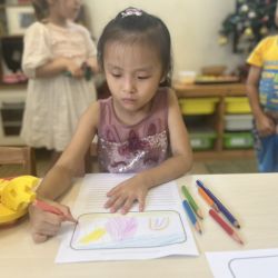 Lucy focusing on her journal writing