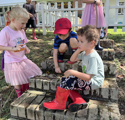 Regan, Finley and Trevor making a camp fire