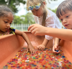 Reina , Trevor and Issy exploring their senses with the water beads.
