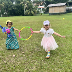 Reina and Izzy with their pretend wings , “ fly power “  .